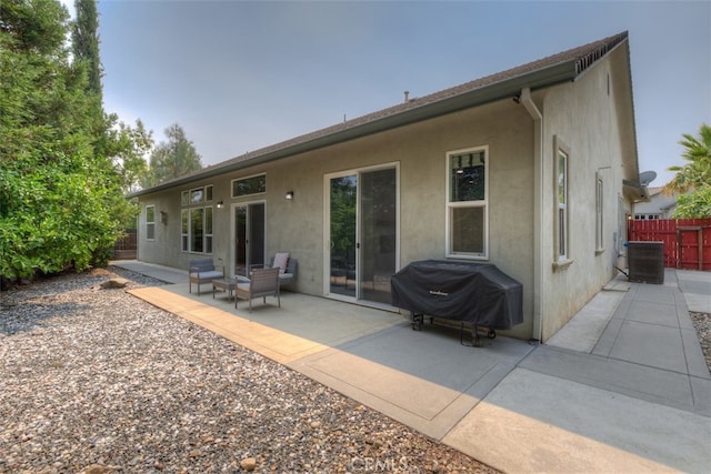 back of property with a patio and cooling unit