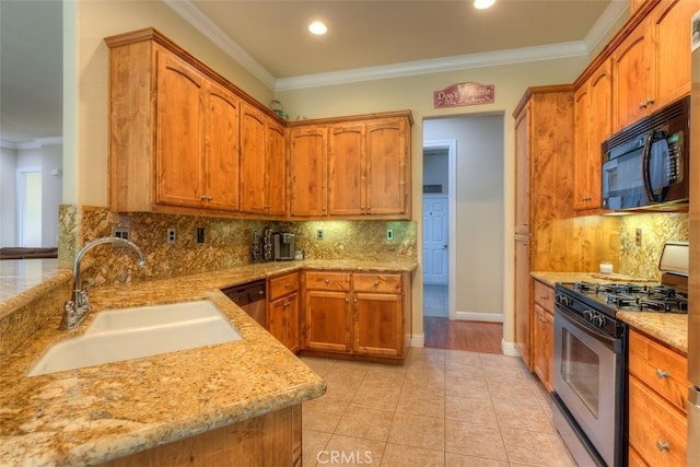 kitchen with stainless steel appliances, crown molding, and sink