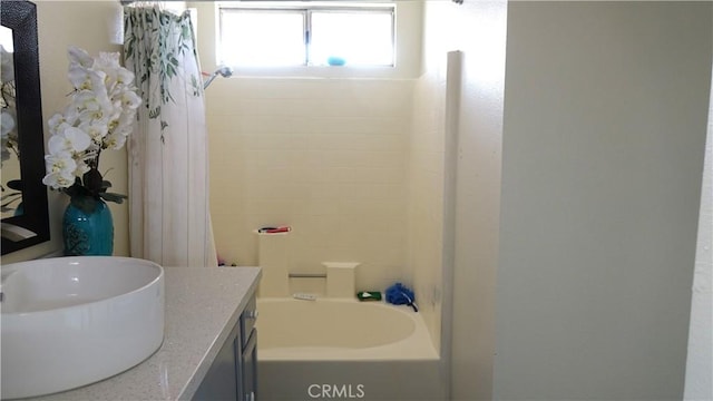 bathroom featuring vanity and bathing tub / shower combination