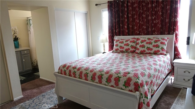 bedroom featuring dark colored carpet