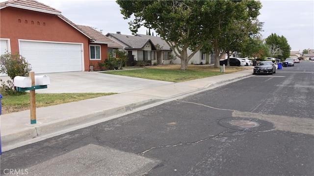 view of front facade with a garage and a front yard