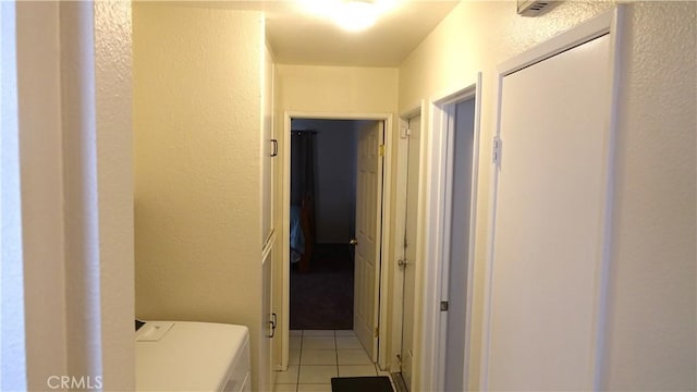 corridor with light tile patterned floors