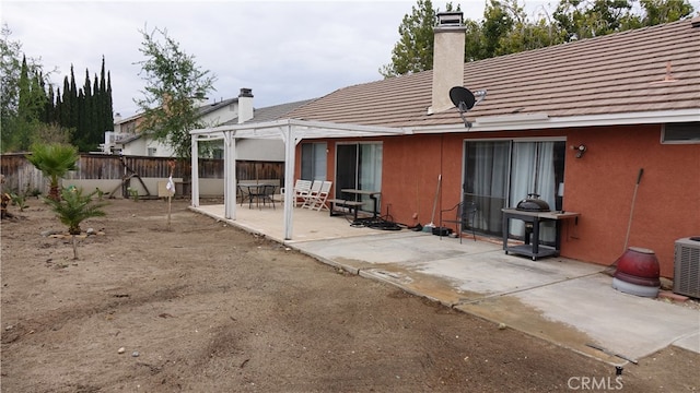 back of property with a patio