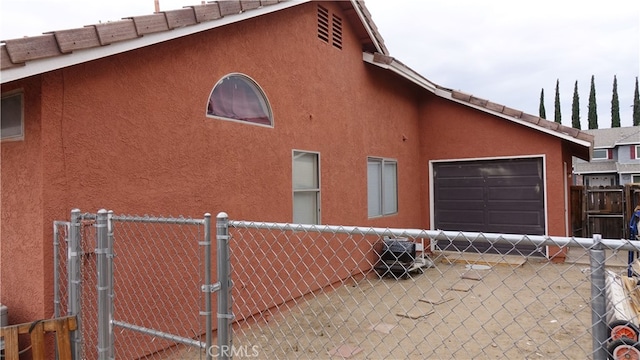 view of home's exterior featuring a garage