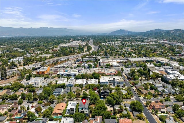 birds eye view of property with a mountain view