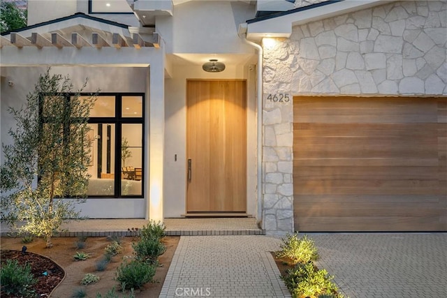 entrance to property featuring a garage