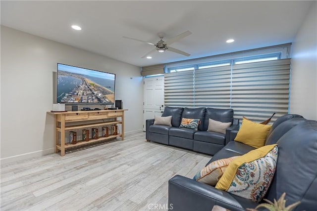 living room with ceiling fan and light wood-type flooring