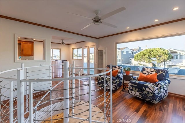 interior space with wood-type flooring, ornamental molding, and french doors