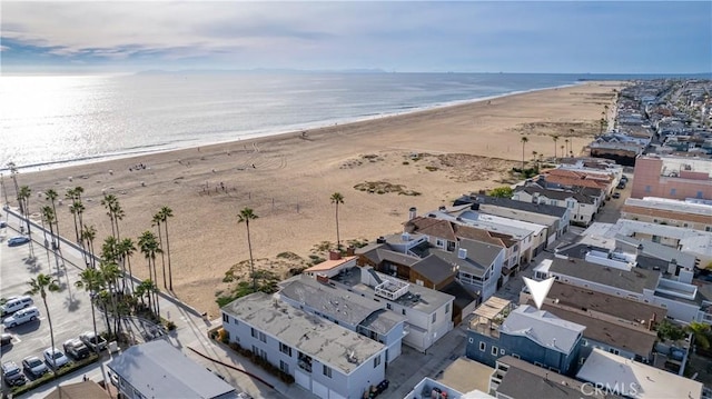 bird's eye view featuring a beach view and a water view