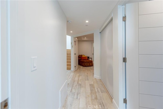 hallway with light wood-type flooring