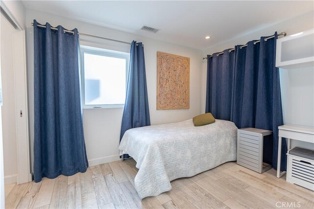 bedroom featuring hardwood / wood-style flooring