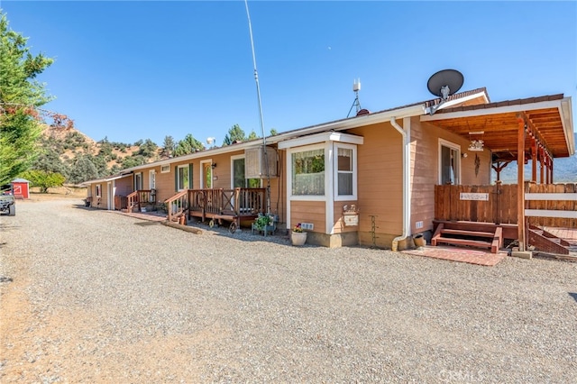 view of front of home featuring a wooden deck