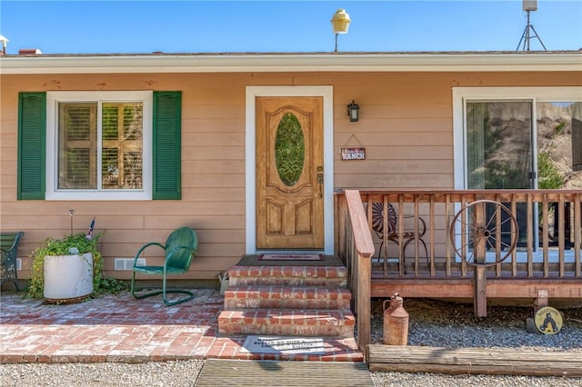 doorway to property with a deck