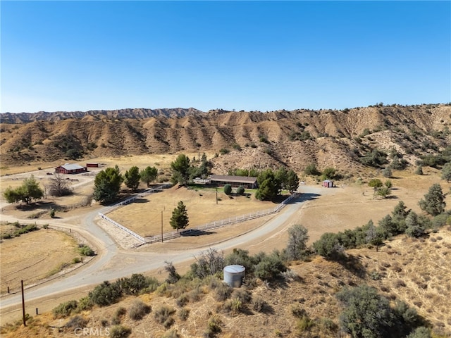 drone / aerial view with a mountain view, a rural view, and view of desert