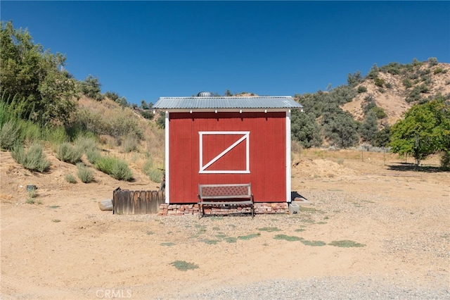 view of shed with a mountain view