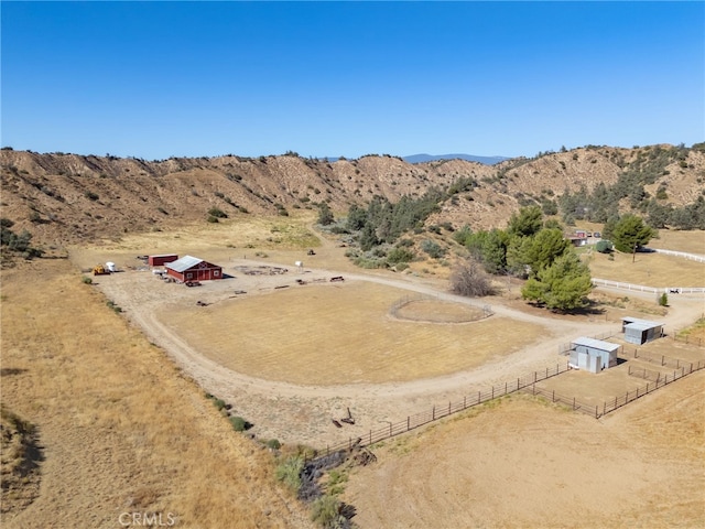 bird's eye view featuring a rural view and a mountain view