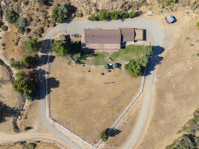 birds eye view of property with a rural view