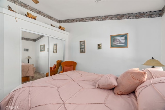 carpeted bedroom with a closet