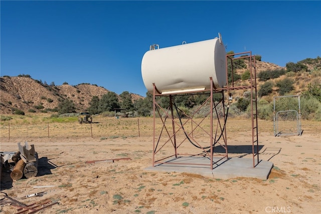 view of yard featuring a rural view and a mountain view