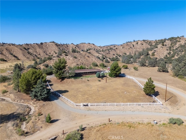 drone / aerial view featuring a rural view and a mountain view