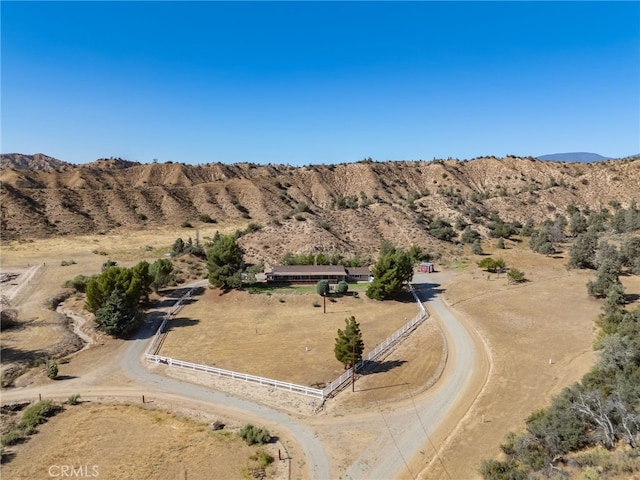 birds eye view of property with a rural view, a desert view, and a mountain view