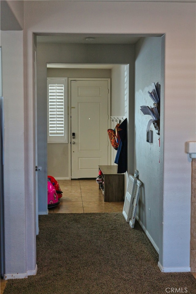 hallway with carpet flooring