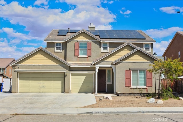 view of front of property with stucco siding, driveway, fence, a chimney, and a tiled roof