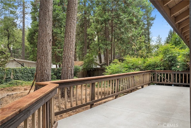 wooden terrace featuring a patio area