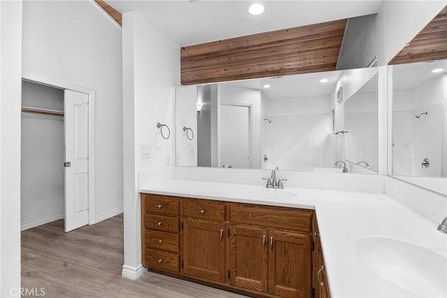 bathroom with vanity, bathtub / shower combination, and hardwood / wood-style floors
