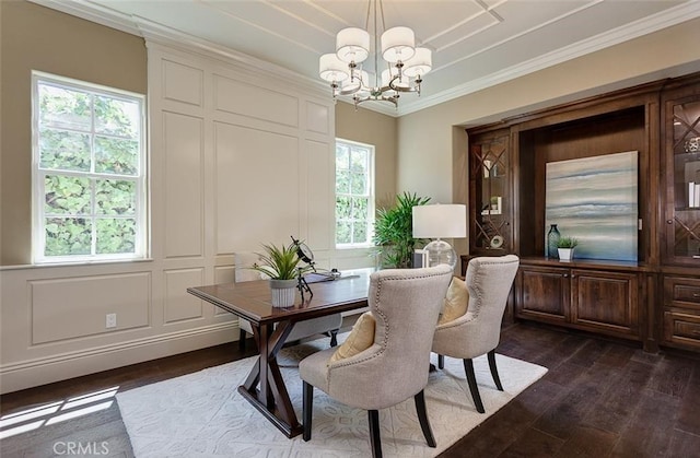 dining space with ornamental molding, an inviting chandelier, a wealth of natural light, and dark wood-type flooring