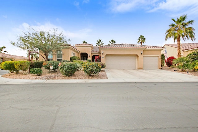 mediterranean / spanish-style home featuring a garage