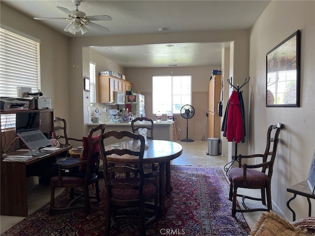 dining room featuring ceiling fan