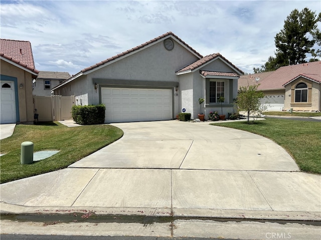 view of front of property with a front yard and a garage