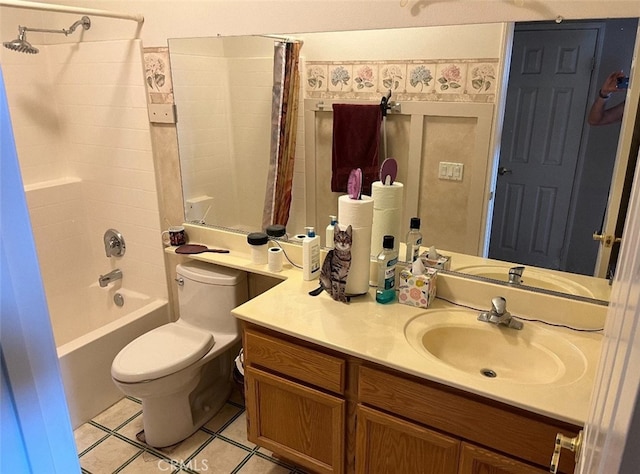 full bathroom featuring vanity, shower / bath combo with shower curtain, toilet, and tile patterned floors