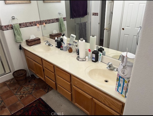 bathroom with walk in shower and vanity