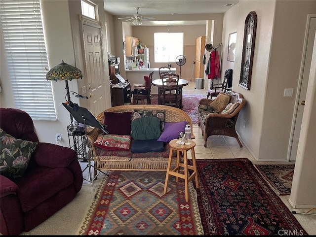 living room with ceiling fan and light tile patterned floors