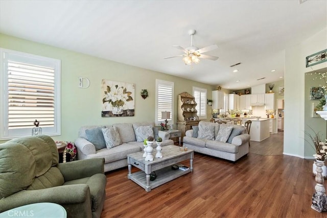 living area with ceiling fan, recessed lighting, visible vents, vaulted ceiling, and dark wood finished floors