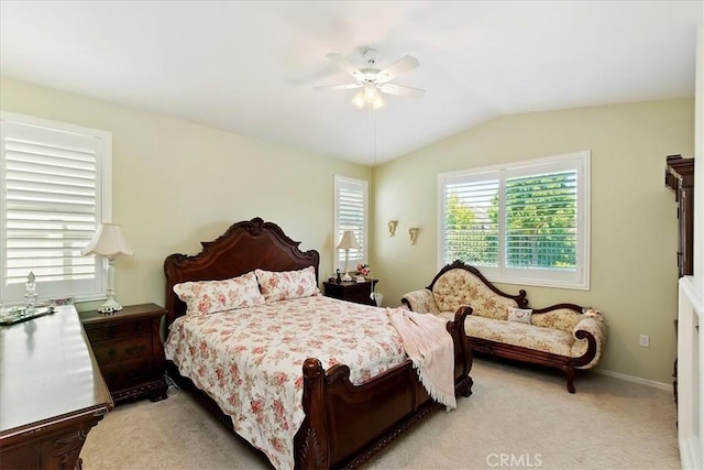 bedroom with light carpet, ceiling fan, lofted ceiling, and baseboards