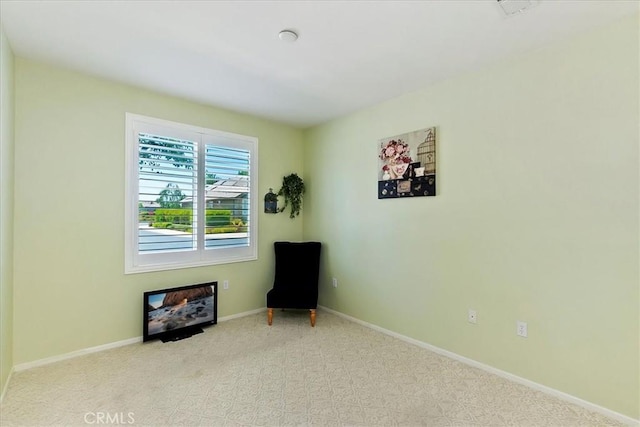 unfurnished room featuring carpet floors and baseboards