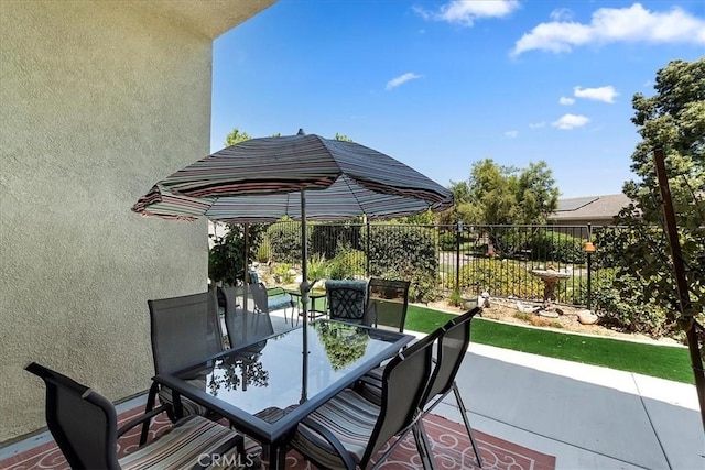 view of patio / terrace with outdoor dining area and fence