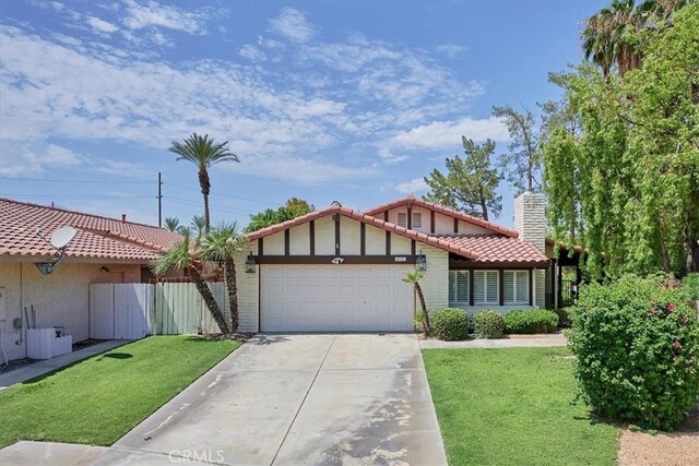 view of front of home featuring a garage and a front yard