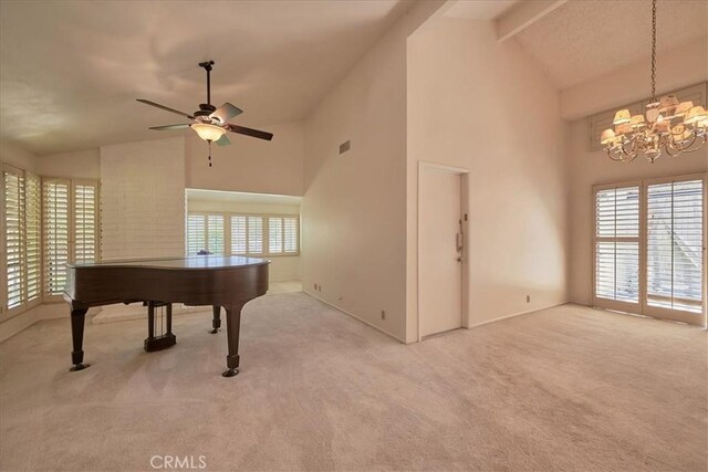 recreation room featuring beamed ceiling, a healthy amount of sunlight, carpet flooring, and high vaulted ceiling