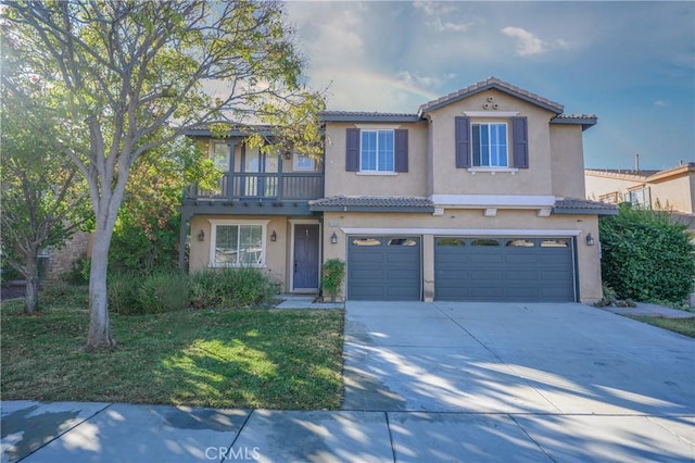 view of front of home featuring a garage and a front yard