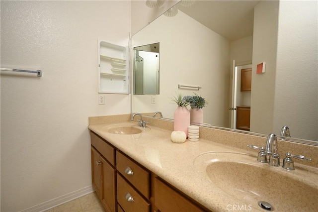 bathroom with tile patterned floors, vanity, and vaulted ceiling