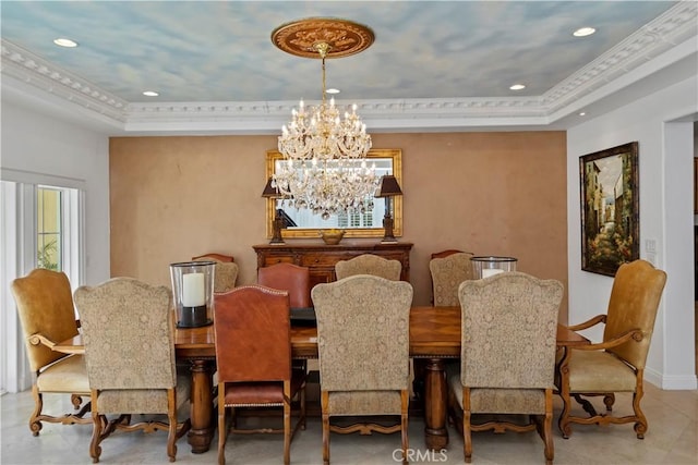 dining space with an inviting chandelier, ornamental molding, and a raised ceiling