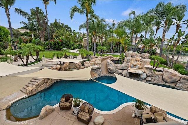 view of swimming pool featuring a patio area