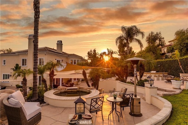 view of patio terrace at dusk