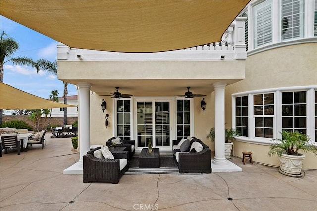 view of patio with a balcony, an outdoor hangout area, and ceiling fan