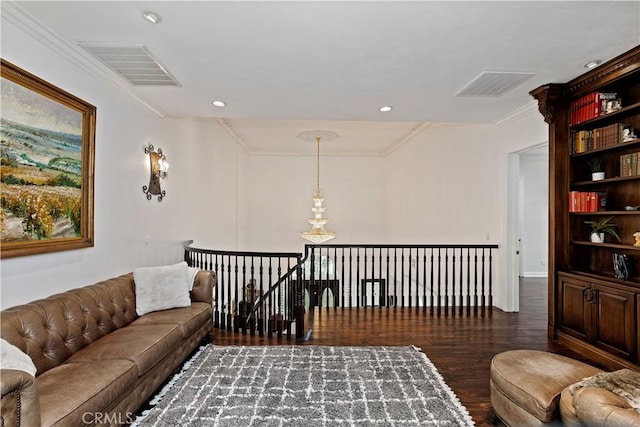 living room with crown molding and dark hardwood / wood-style floors