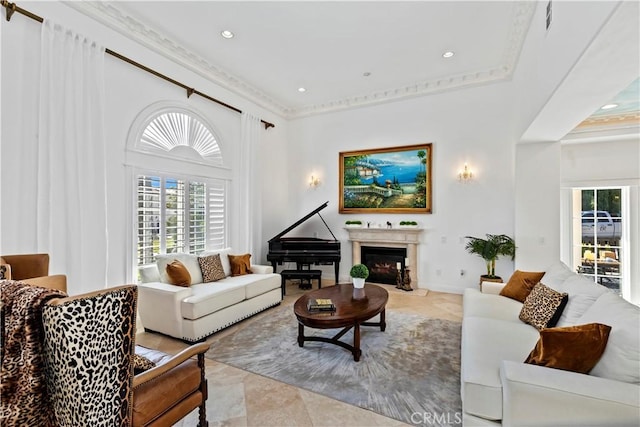 tiled living room featuring ornamental molding and a towering ceiling